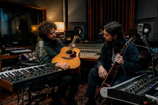 Independent musicians creating indie rock and indie pop music in a recording studio