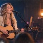 White female singer-songwriter performing storytelling through music
